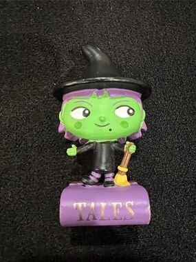 Green Witch Collectible Figure with Purple Base and Broom